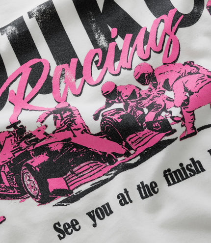 Close up of white Duke & Dexter vintage T shirt showing bold black and pink graphic design
