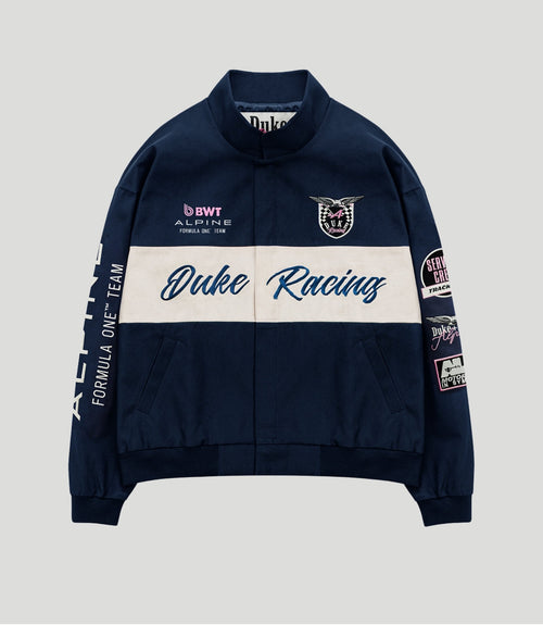 Navy BWT Alpine racing jacket with a white centered panel, Duke Racing script and crest patch on the chest