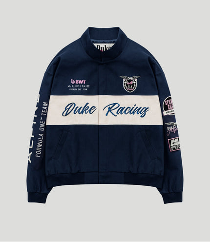 Navy BWT Alpine racing jacket with a white centered panel, Duke Racing script and crest patch on the chest