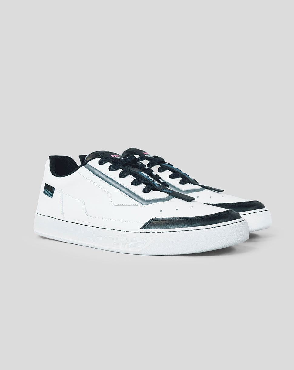Pair of white BWT Alpine Endstate sneakers with black toe caps and metallic side stripe viewed from a three-quarter angle