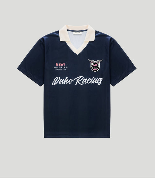Navy polo jersey with cream collar and Duke Racing crest on the chest
