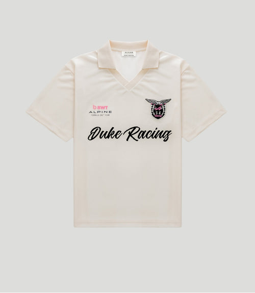Gold BWT Alpine Formula One Team Duke Racing polo jersey with crest and sponsor logos.