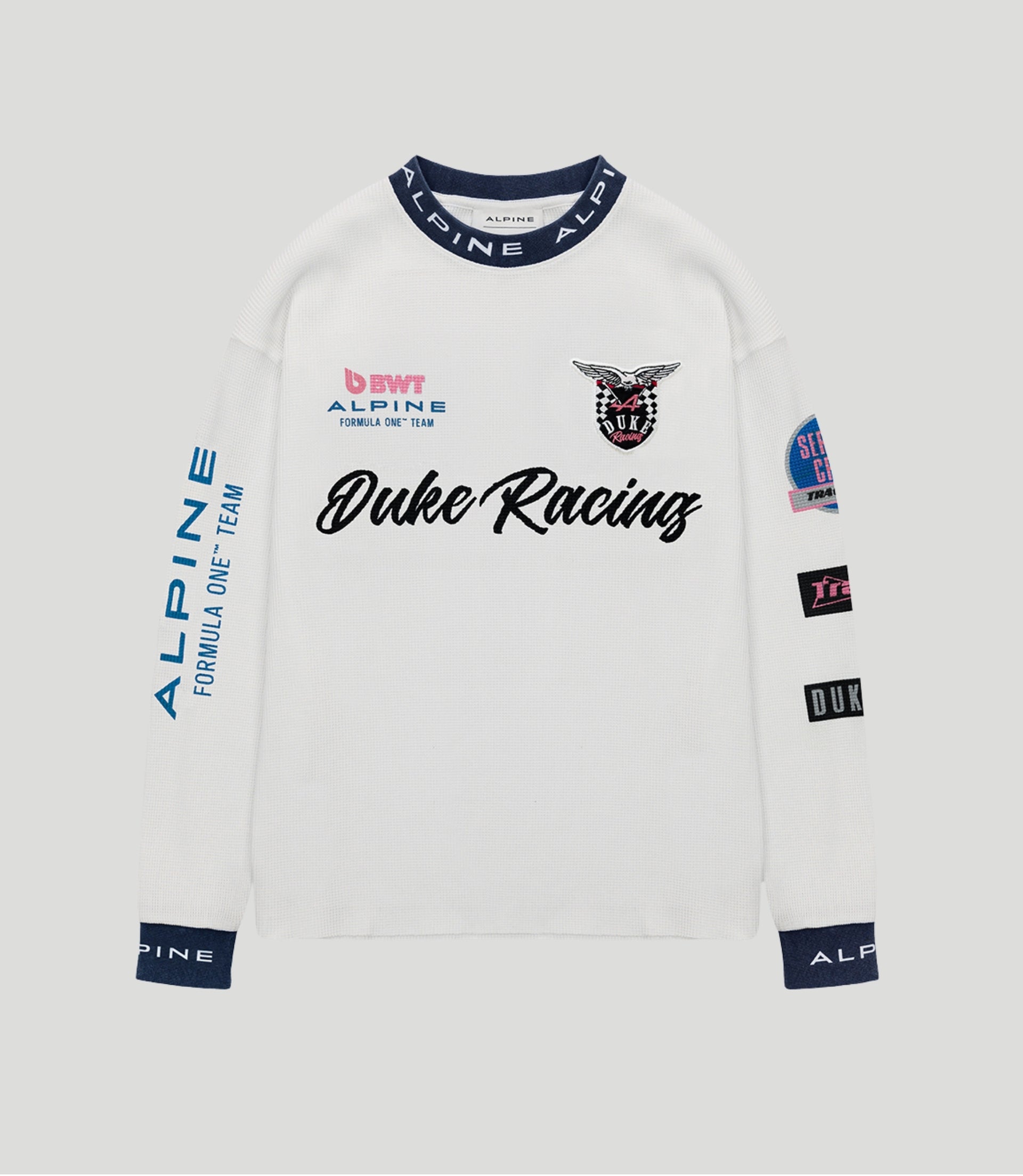 White Duke & Dexter BWT Alpine Formula One Team jersey with navy collar and Duke Racing crest